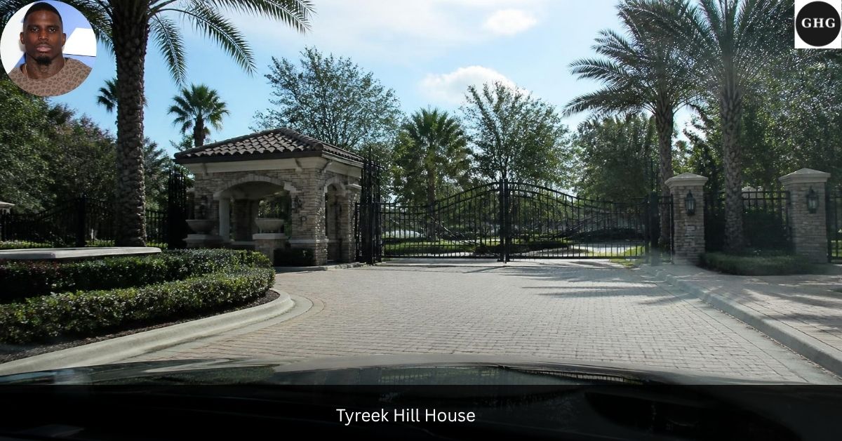 Tyreek Hill house gated entrance with stone gatehouse and palm trees, Southwest Ranches, Florida